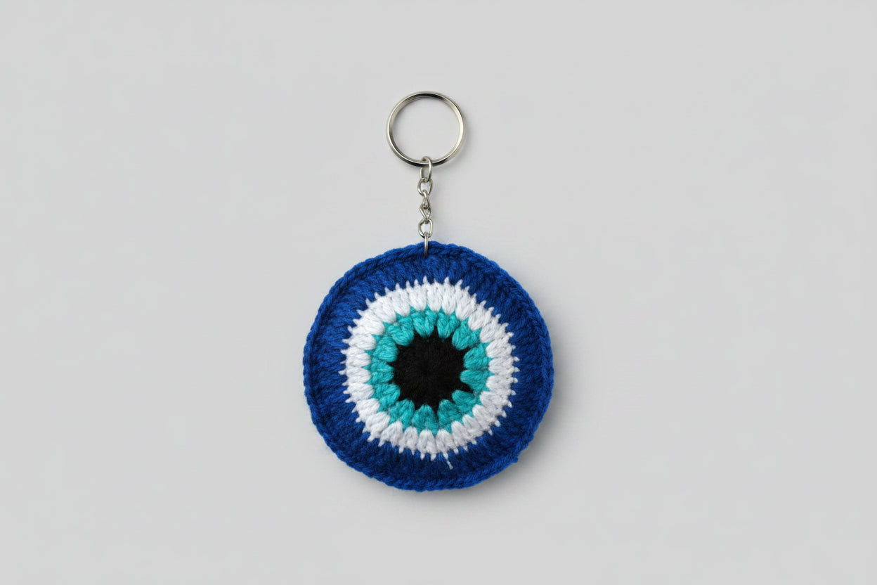 Handmade crochet evil eye nazar keychain in blue and white by The Crochet Nest