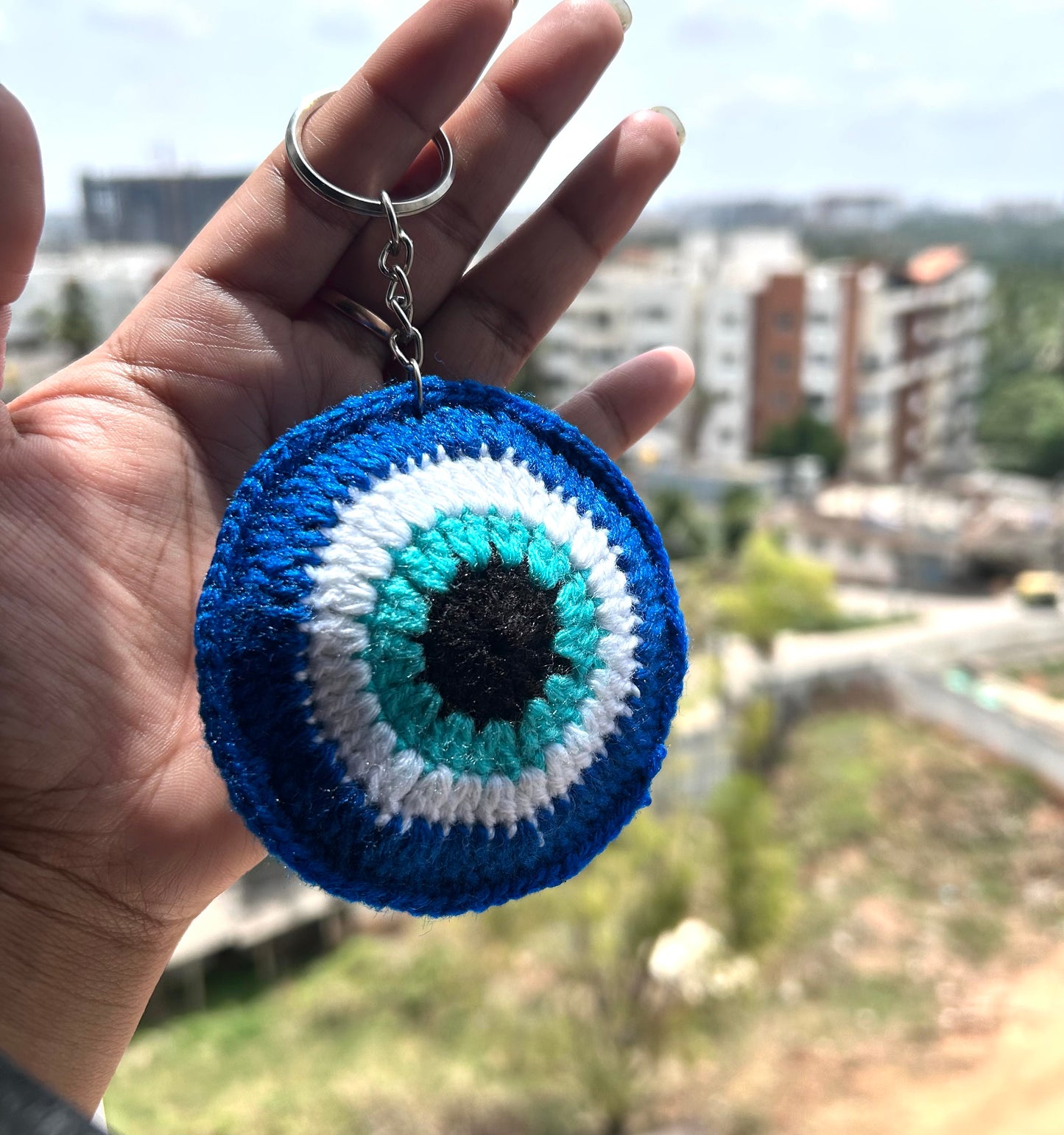 Handmade crochet evil eye nazar keychain in blue and white by The Crochet Nest
